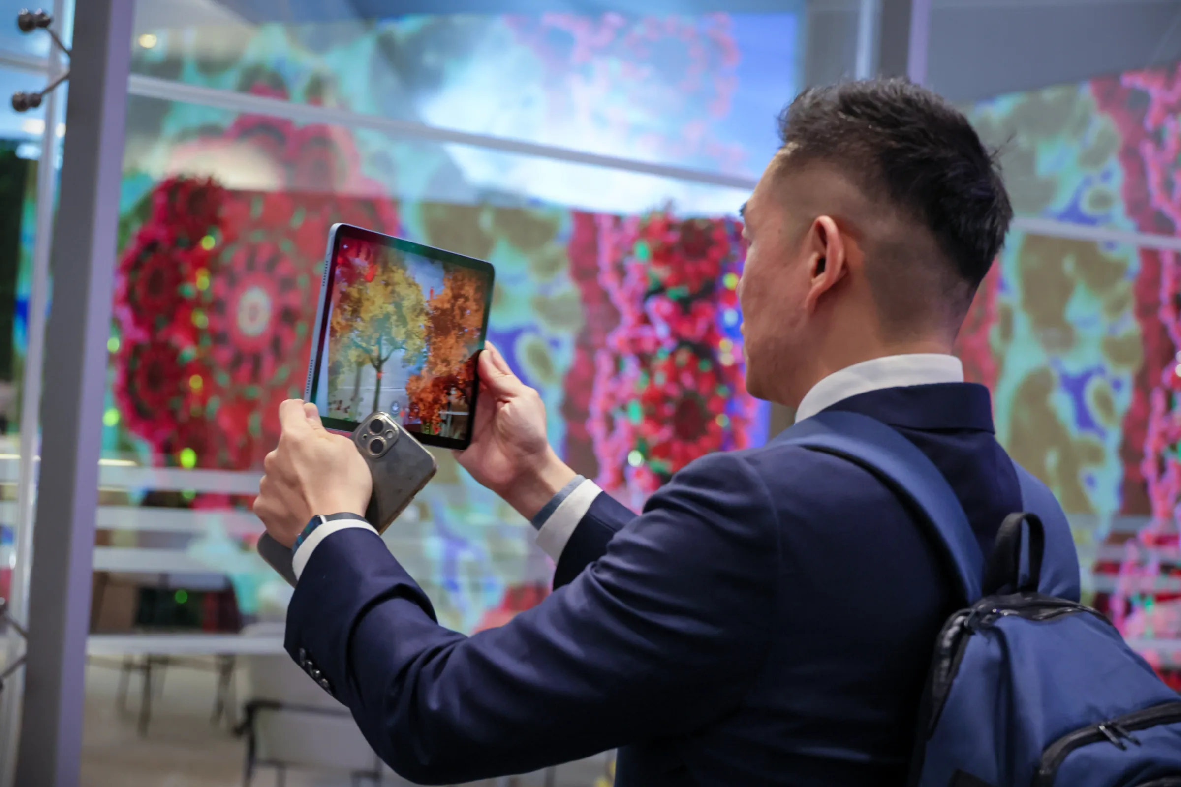 MOMENTUM by Victoria Fard at WEF AMNC26 in Dalian, an AR world visitors move through